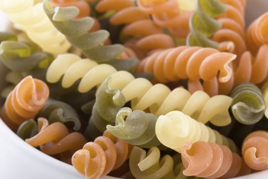 Closeup of dried multicolored fusilli pasta