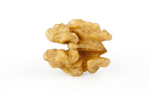 Two raw shelled walnut halves on white background