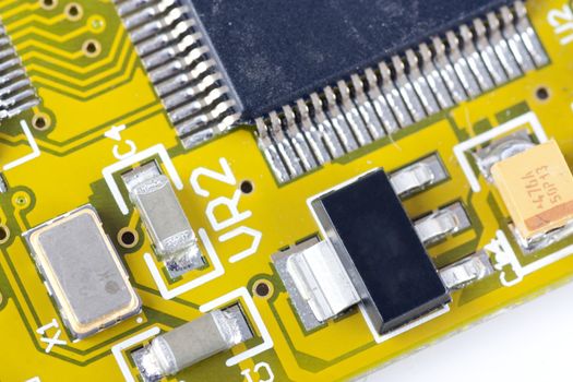 Closeup of circuit board showing circuits and microprocessor.  