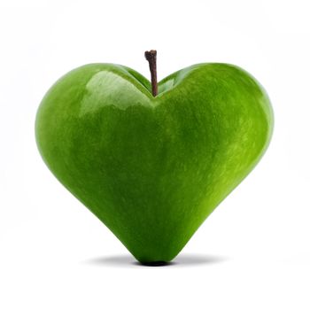 heart shaped fresh green apple over white
