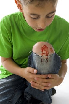 a young boy with a painful leg on white