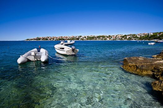 croatian coastline and boats docked in bay