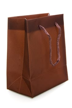 a chocolate-brownl bag on a white background