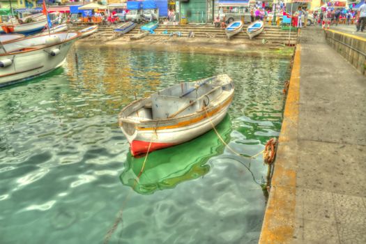 An old itailan row boat processed to appear as if it were painted.