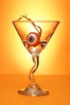 An eyeball garnishes this halloween style martini.