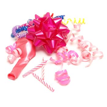 A group of various pink party supplies on a white background.