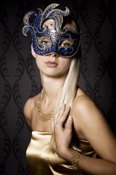 attractive woman wearing mask, over wallpaper background