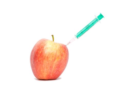 Red apple with a syringe on white background