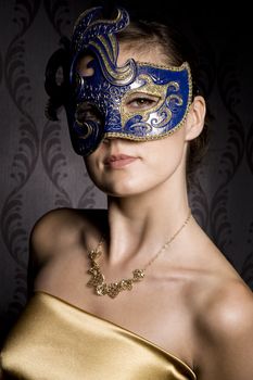 portrait of woman in mask over wallpaper background