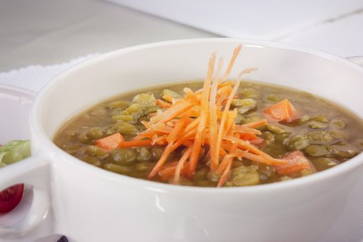 Close up of pea soup with carrots
