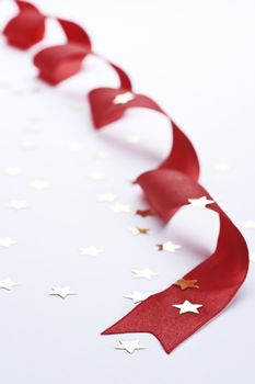 decorative red ribbon with stars on white background