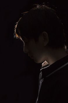 Portrait of an Asian man in the darkness for texture 