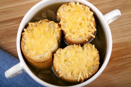 Onion soup with cheese bread on top.