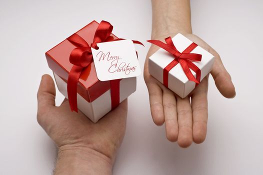 chritmas gifts on hands on white backround