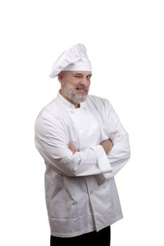Portrait of a happy chef winking in a chef's hat and uniform isolated on a white background.