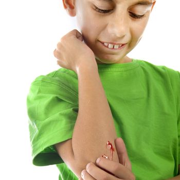 a young boy with a painful elbow on white