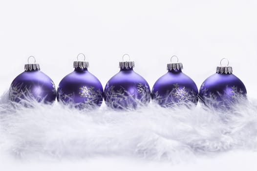 row of christmas balls isolated on white background 