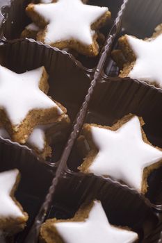 star shaped glazed cookies in box, close up