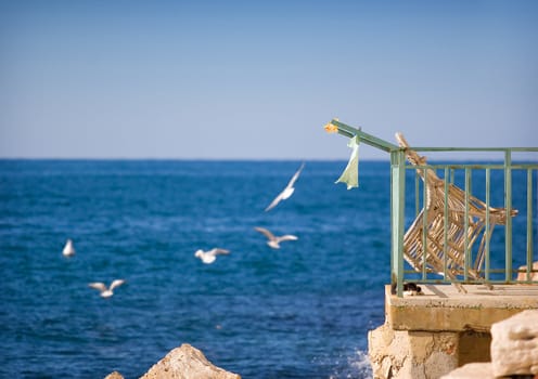 Balcony on an old house near the sea with beautiful view.