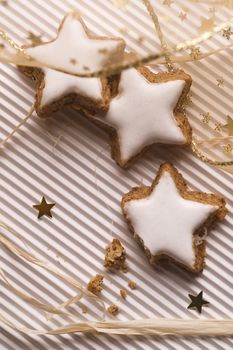 star shaped glazed cookies and decorative gold ribbon