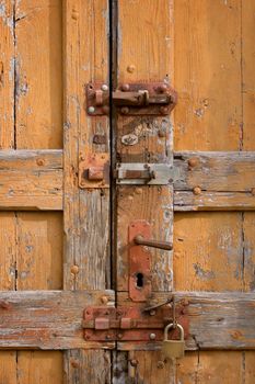 Old grungy locked wooden doors close up photo