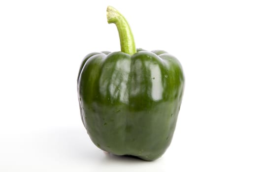 Green bell pepper isolated on white background. 
