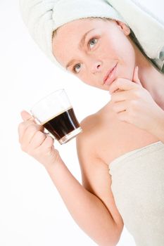 Studio portrait of a spa girl drinking coffee and thinking