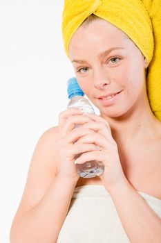 Studio portrait of a spa girl holding a water bottle