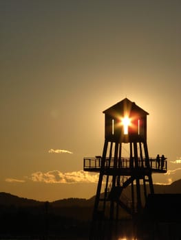 Observation tower in silhouette at sunset in Magog, province of Quebec, Canada