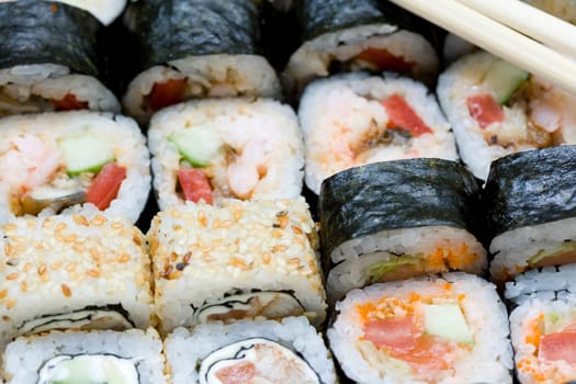 different types of traditional japanese rolls and stiicks close-up 