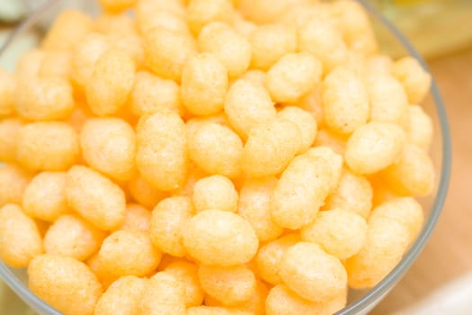 yellow corn chips in a glass plate