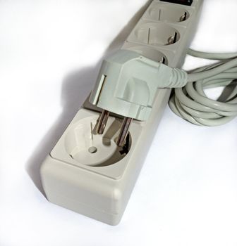 Electric plug and outlet in gray tone on white