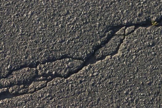 texture series: asphalt road pavement backgroud with crack
