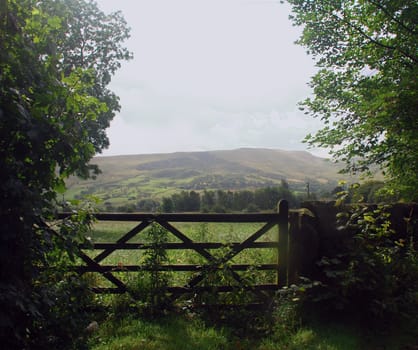 View through a farm gate to the British countryside