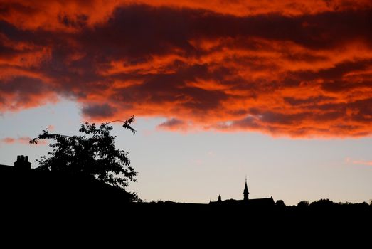 A stunning, naturally-occurring sunset phenomenon over an urban landscape