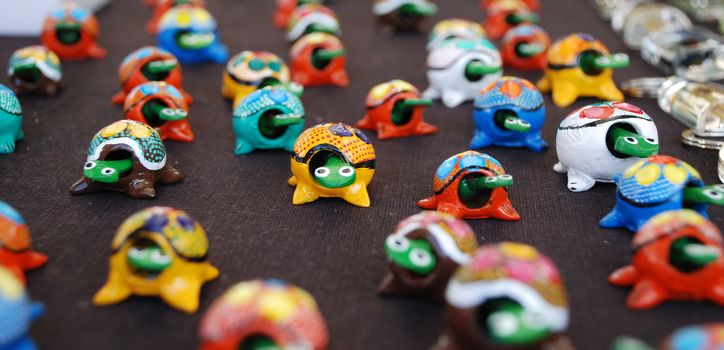 A display of carved turtle toys