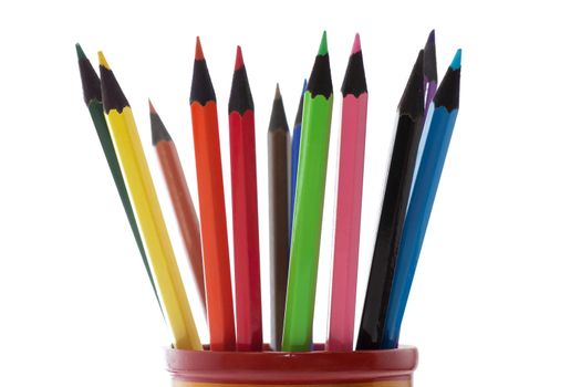 Colored pencils in a cup isolated over white background