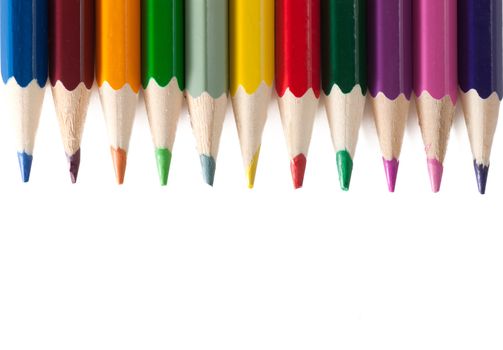 Colored pencils isolated over white background