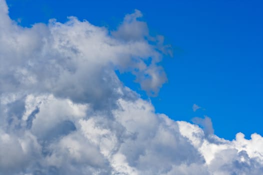 Big cumulus clouds and blue sky