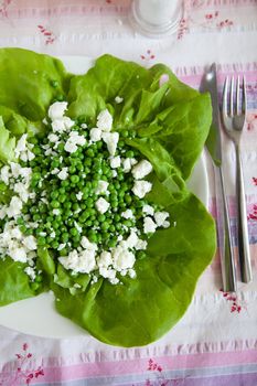 Fresh and healthy salad with green peas and feta