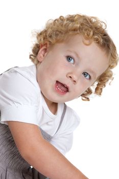Adorable three year old girl with blond curls on white background