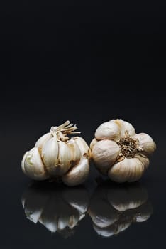 Some garlic isolated on a black background.