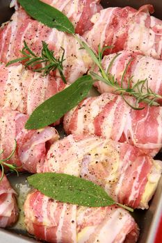 rolls of meat with bacon