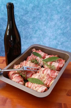 rolls of meat with bacon