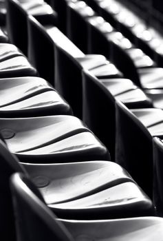 Stadium seats - black and white photo