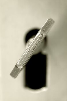 Key in a keyhole , close up photo