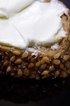 Healthy breakfast - bread and cream cheese close up photo