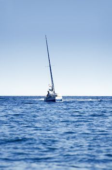 A small boat sailing on a sunny morning