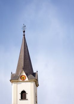 Old church tower with clear blue sky background