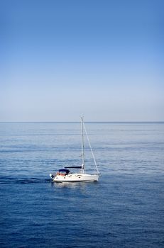 A small boat sailing on a sunny morning